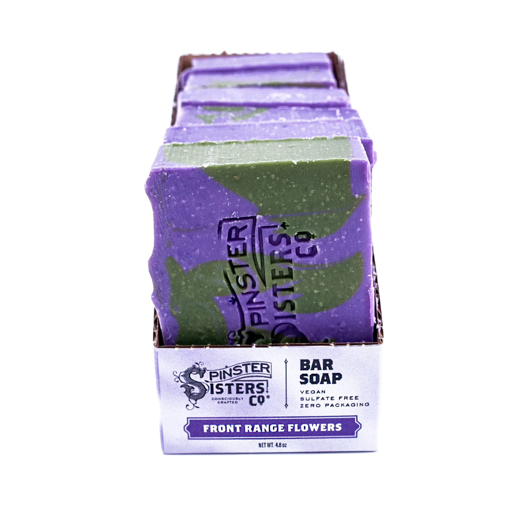 Pack of Front Range Flowers Spinster Sisters Co. bar soaps with purple and green packaging on a white background