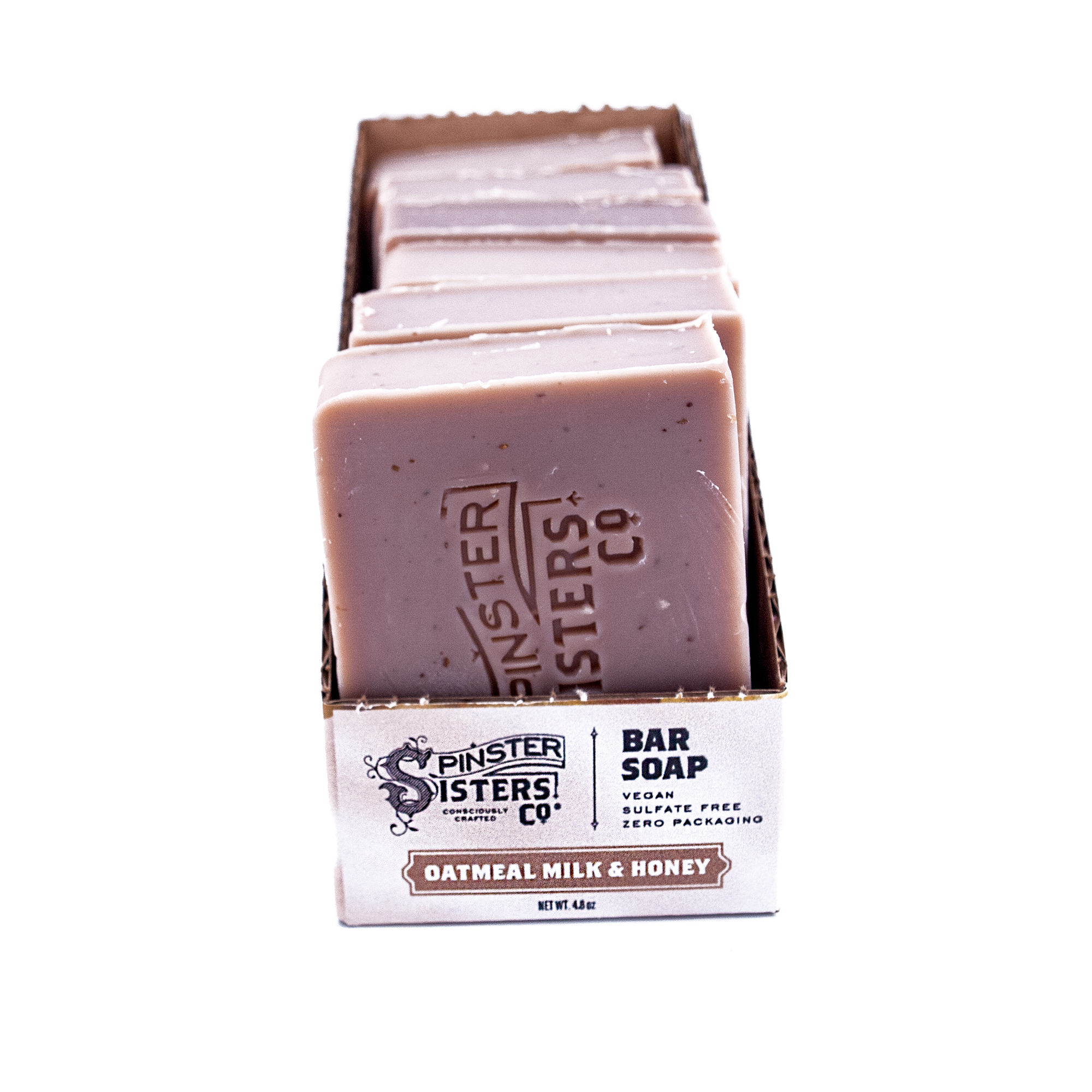 Case of Spinster Sisters Co. Oatmeal Milk & Honey bar soap on a white background