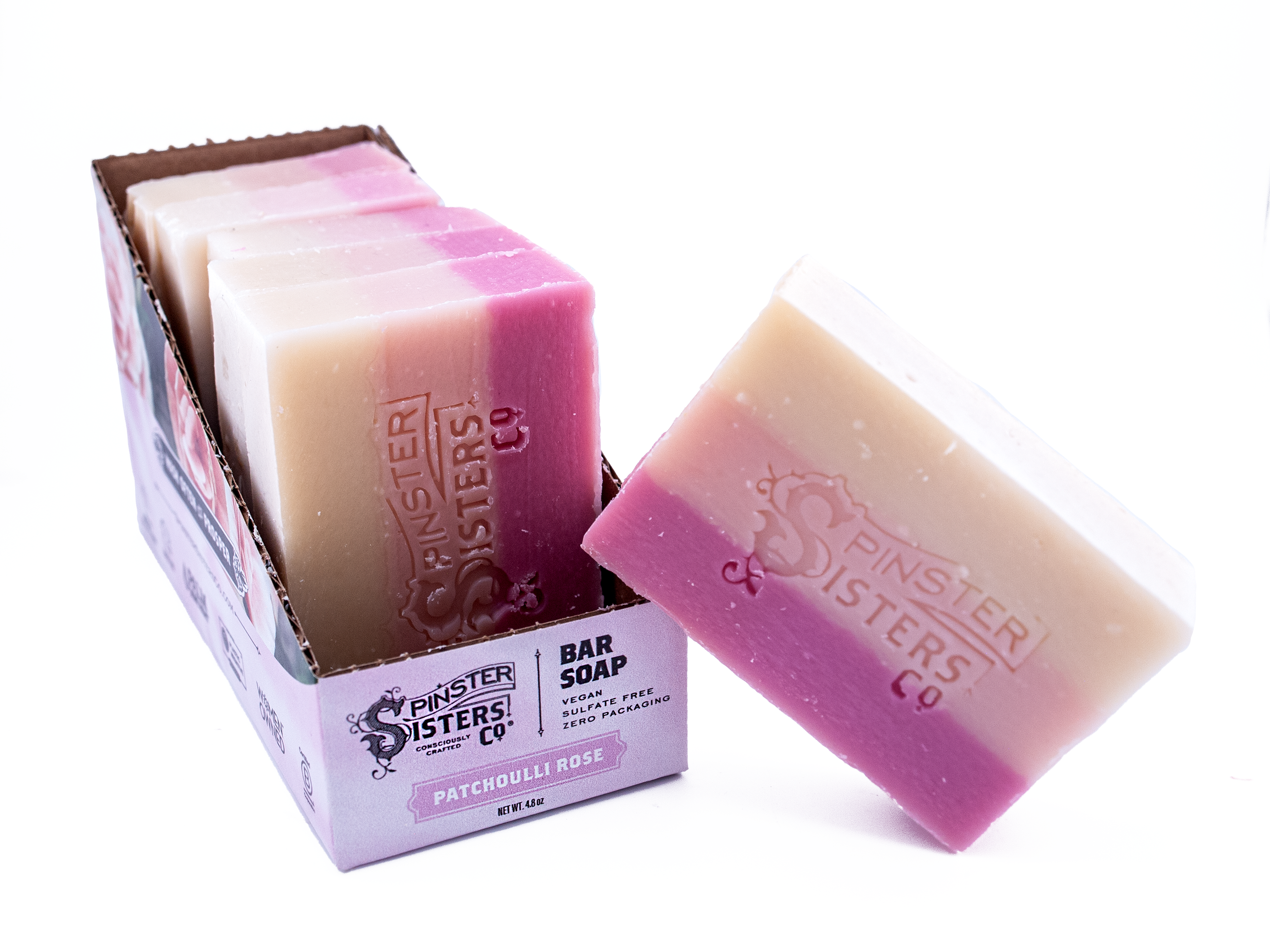 Case Of Patchouli Rose Pink and white bar soap with 'Spinster Sisters Co.' branding on a white background