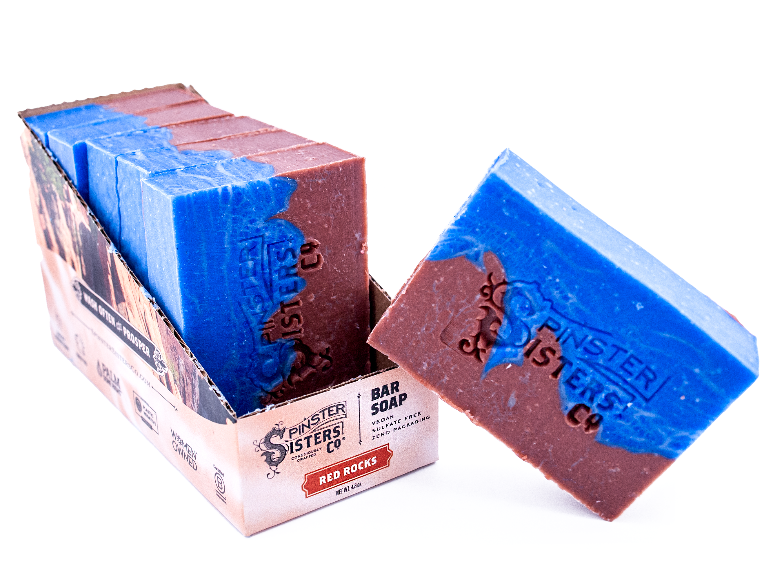 Case of Red Rocks Spinster Sisters Co. bar soaps with a single soap bar displayed in front on a white background.
