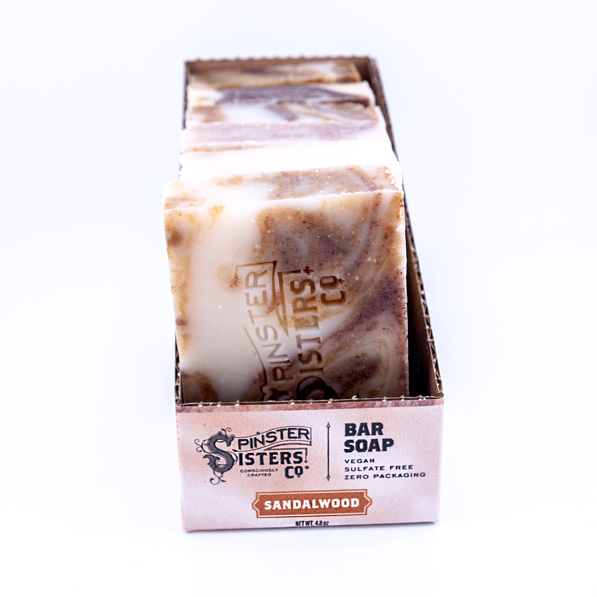 Case of 6 Spinster Sisters Co. sandalwood bar soap on a white background