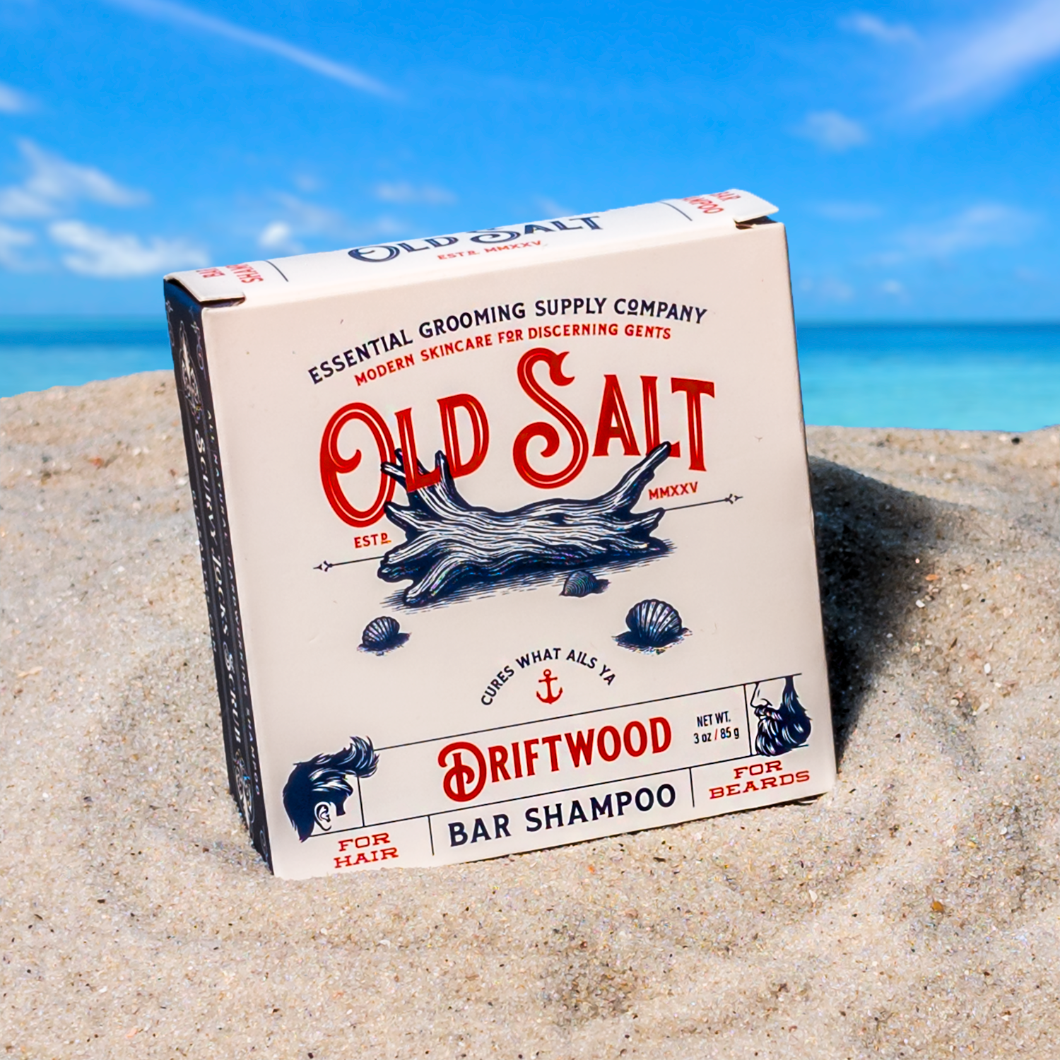 Box of Old Salt Driftwood Shampoo Bar on a Sandy beach