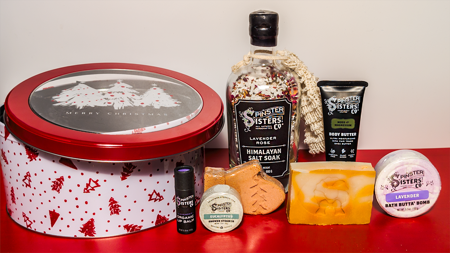 Decorative Christmas tree, Round Tin with Christmas design Featuring Spinster Sisters Bath Products.