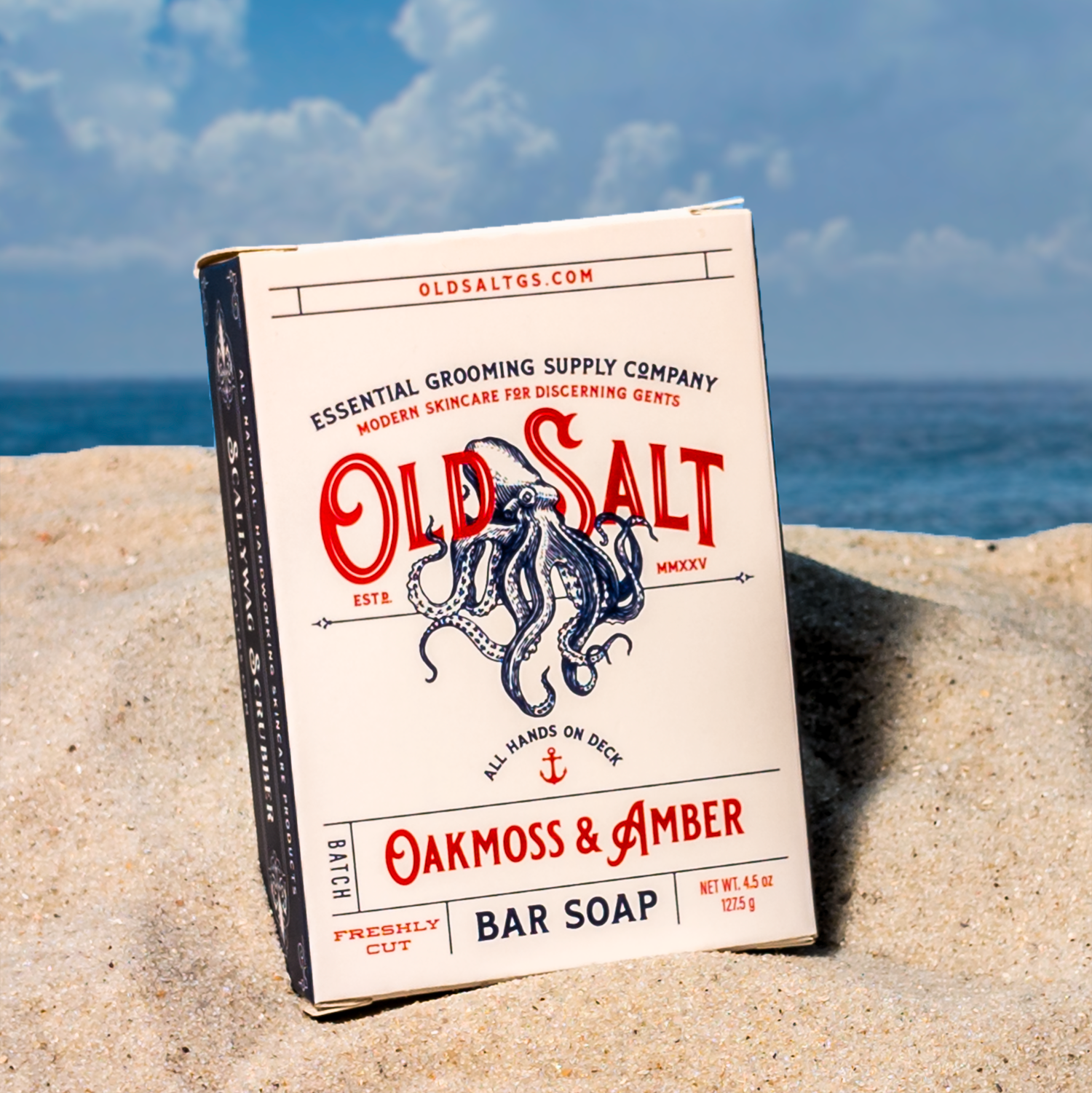 Box of Old Salt Oakmoss & Amber Bar Soap on a Sandy beach