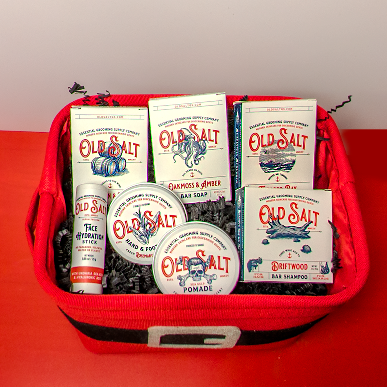 Santa Themed Gift Basket filled with Old Salt product on a Red and White Background