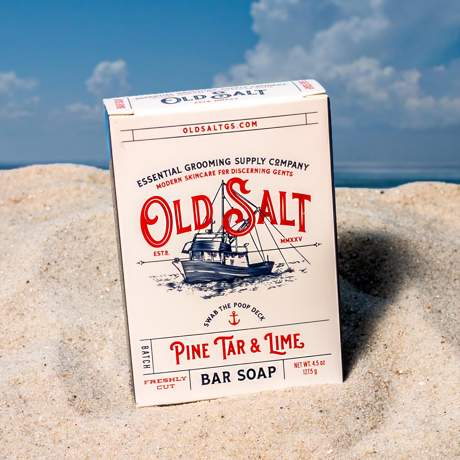 Box of Old Salt Pine Tar & Lime Bar Soap on a Sandy beach
