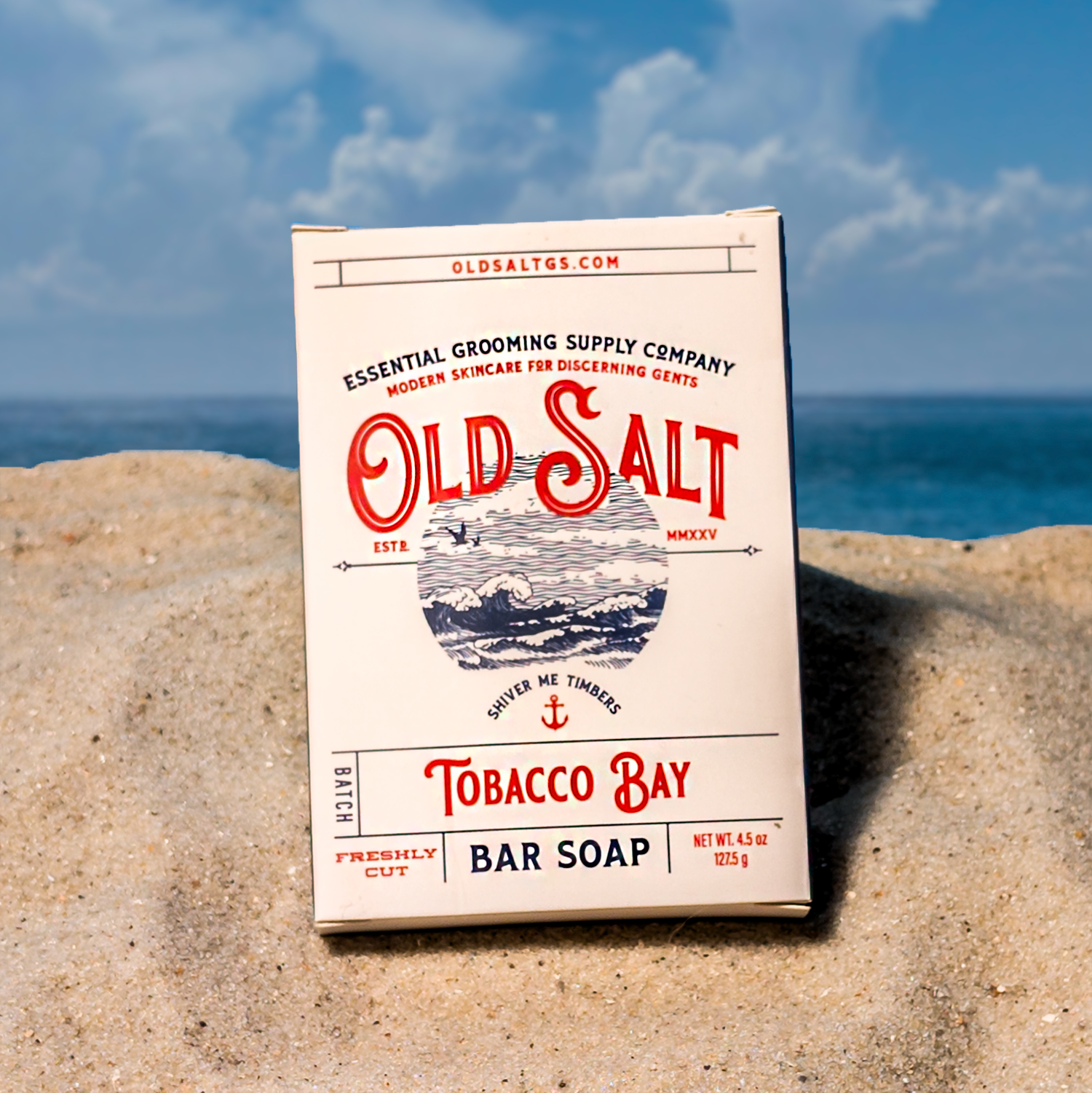 Box of Old Salt Tobacco Bay Bar Soap on a Sandy beach