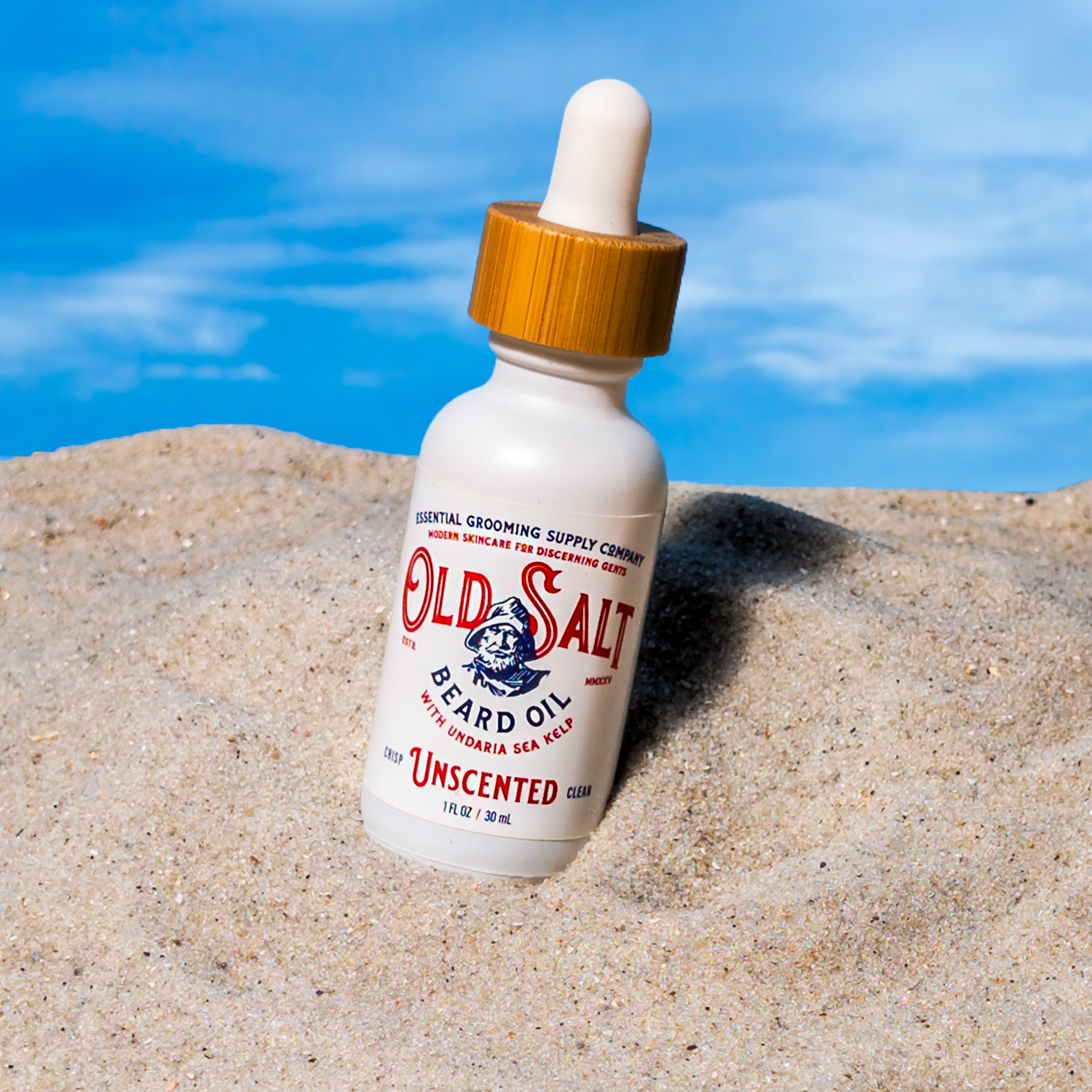 Bottle of Old Salt Beard Oil Unscented on a Sandy beach