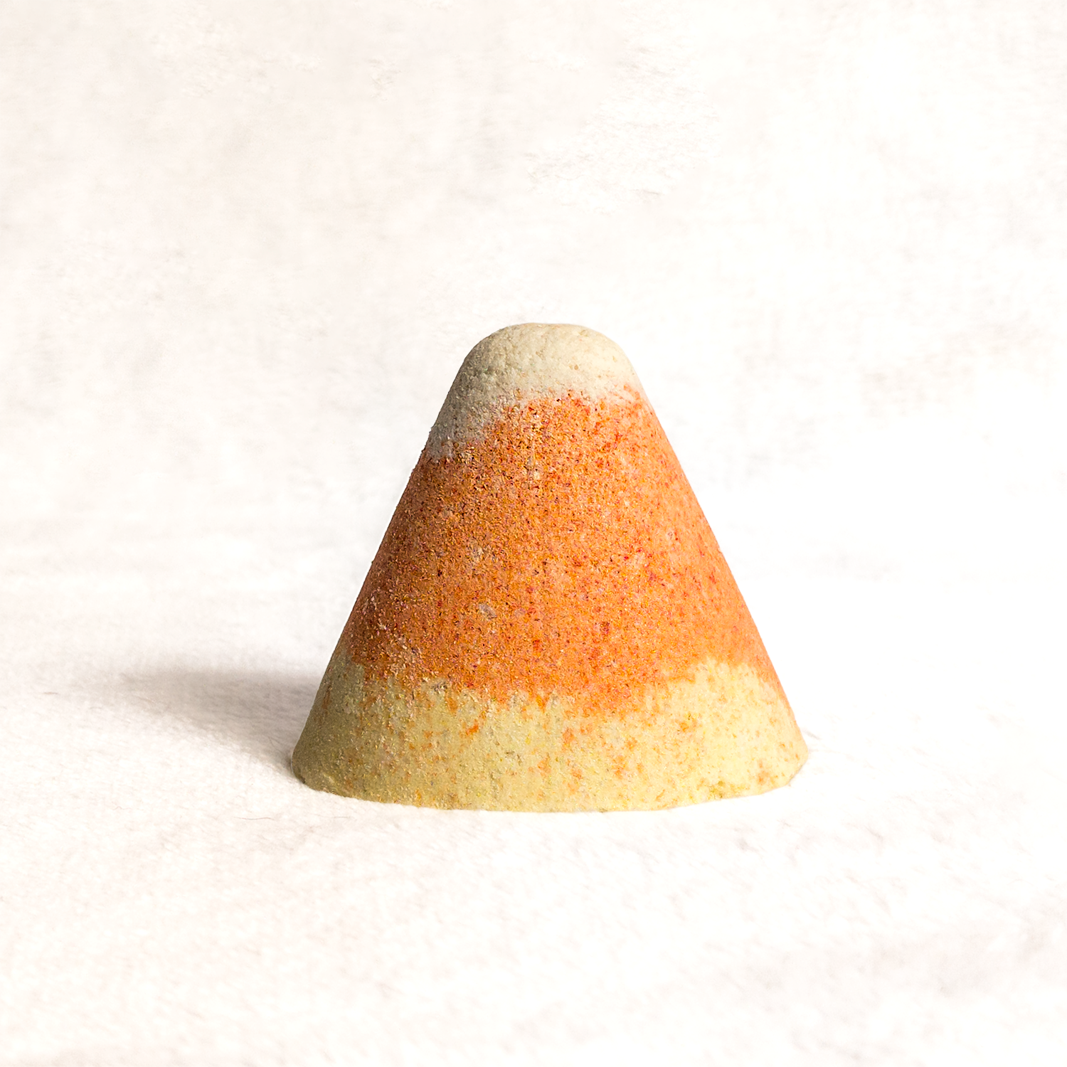 Candy Corn Bath Bomb on a white background
