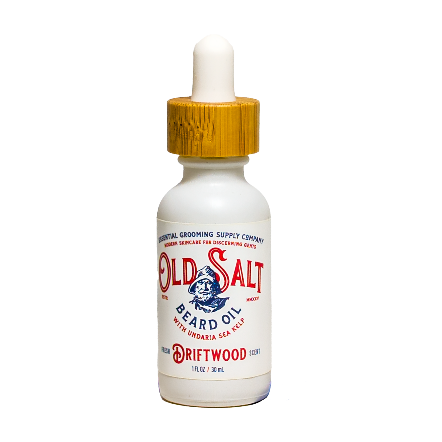 Bottle of Driftwood 'Old Salt' beard Oil with sea kelp on white background