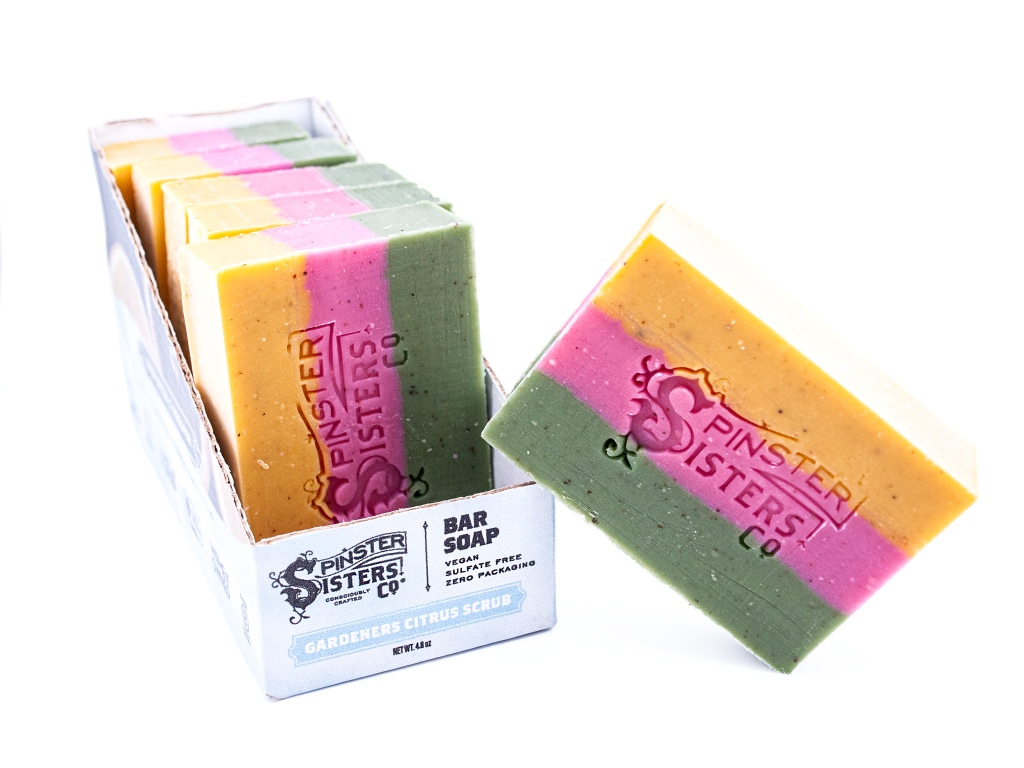 Case of Gardener's Citrus Scrub bar soaps with 'Spinster Sisters Co' branding on a white background