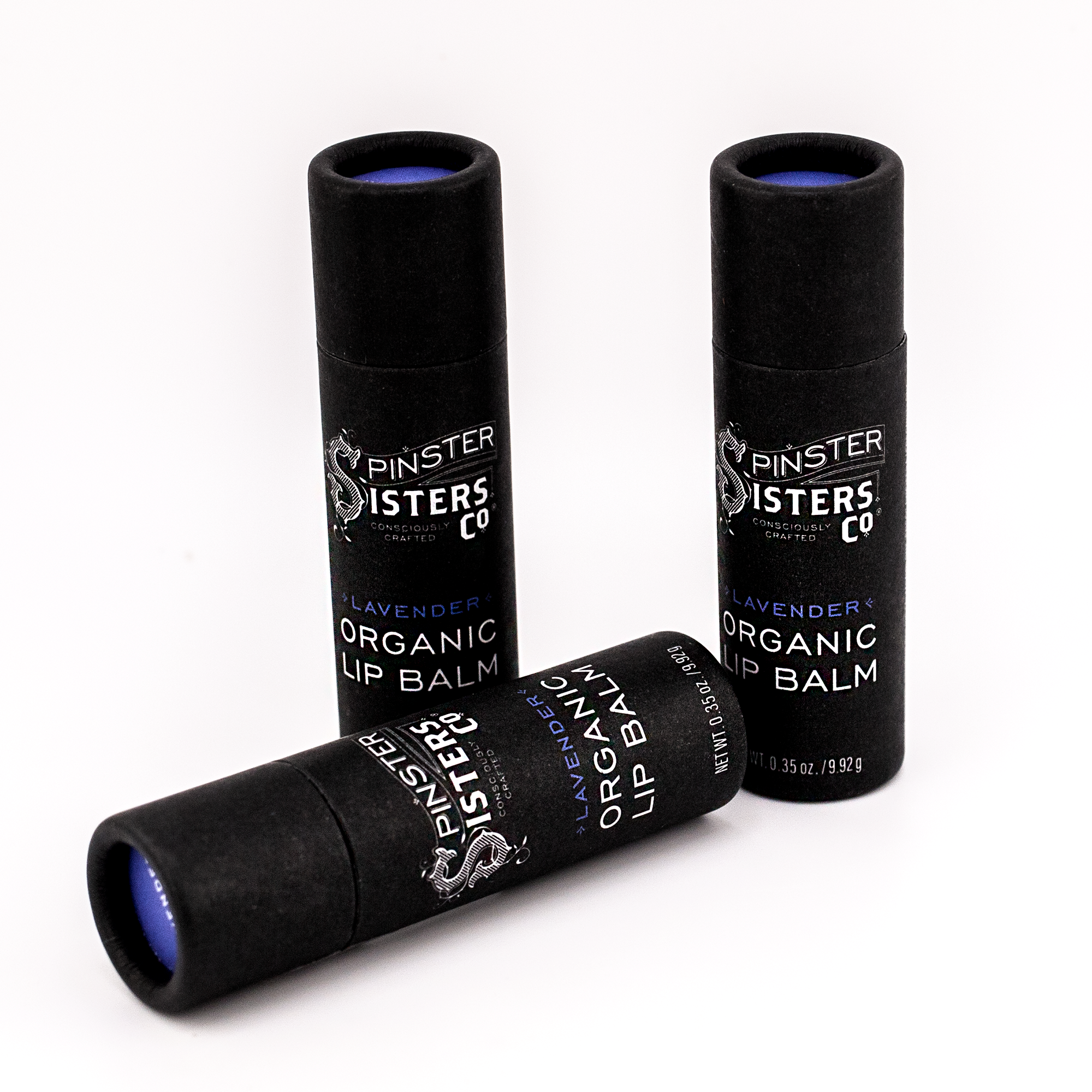 3 black paper tubes that say "Spinster Sisters Lavender Organic Lip Balm" 