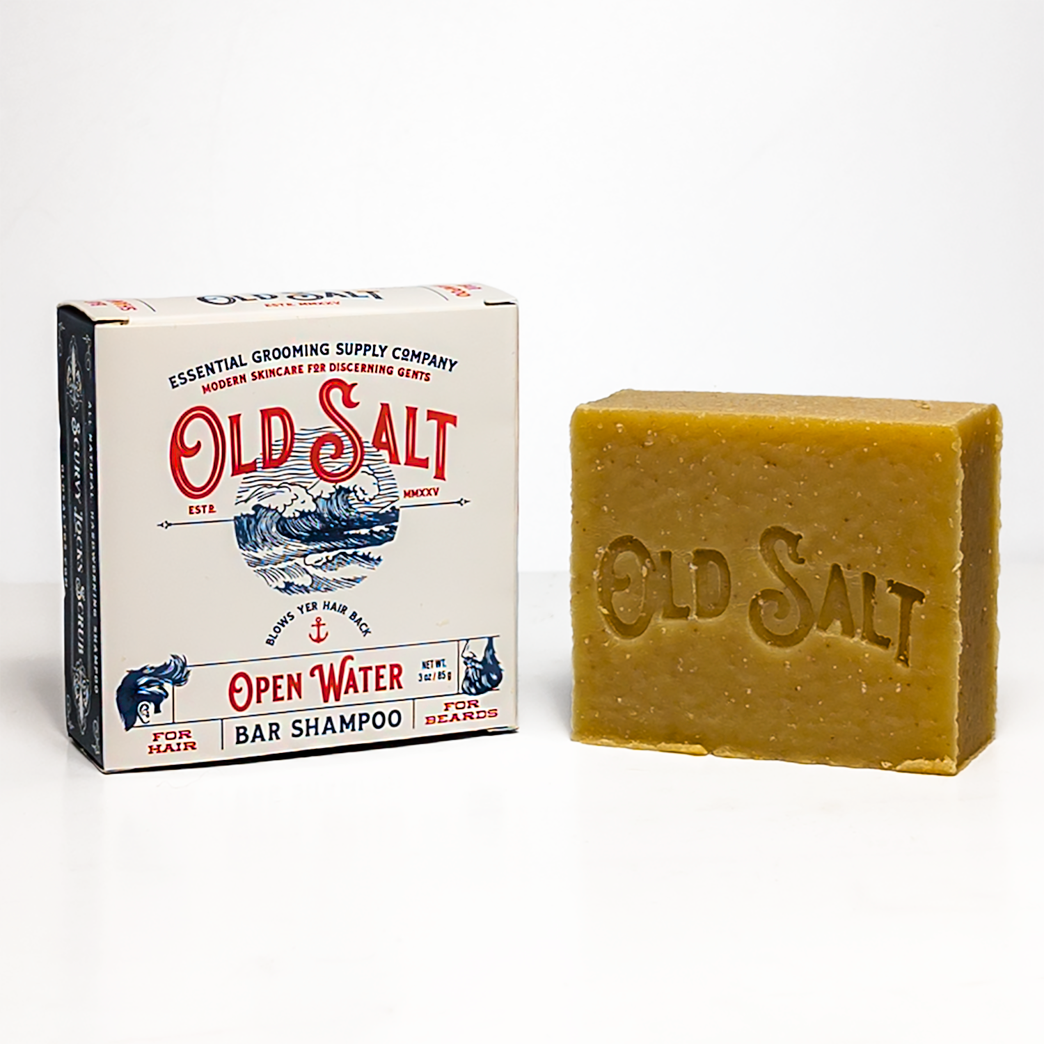 Bar of Old Salt Open Waters Shampoo next to its packaging on a white background