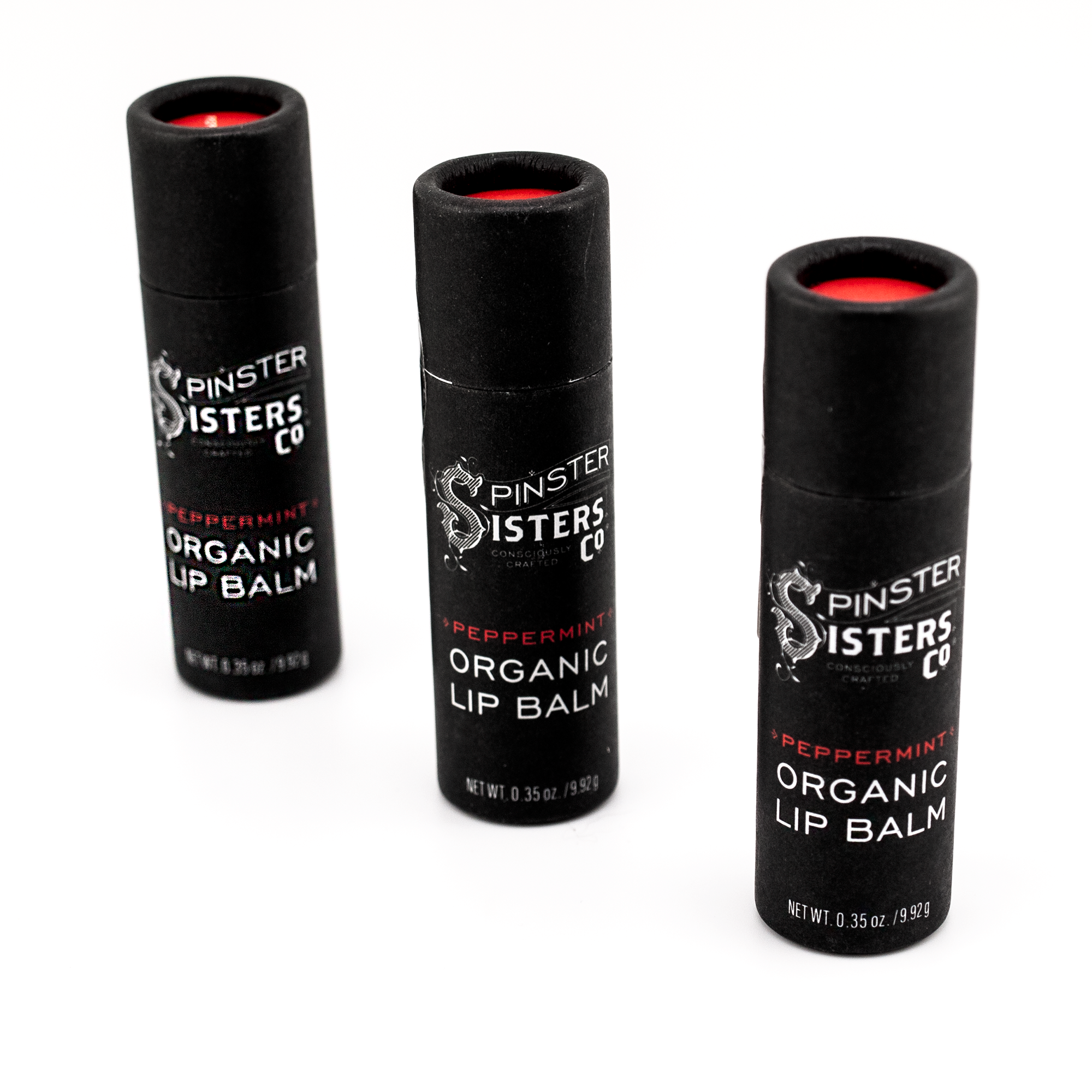 3 black paper tubes that say "Spinster Sisters Peppermint Organic Lip Balm" 