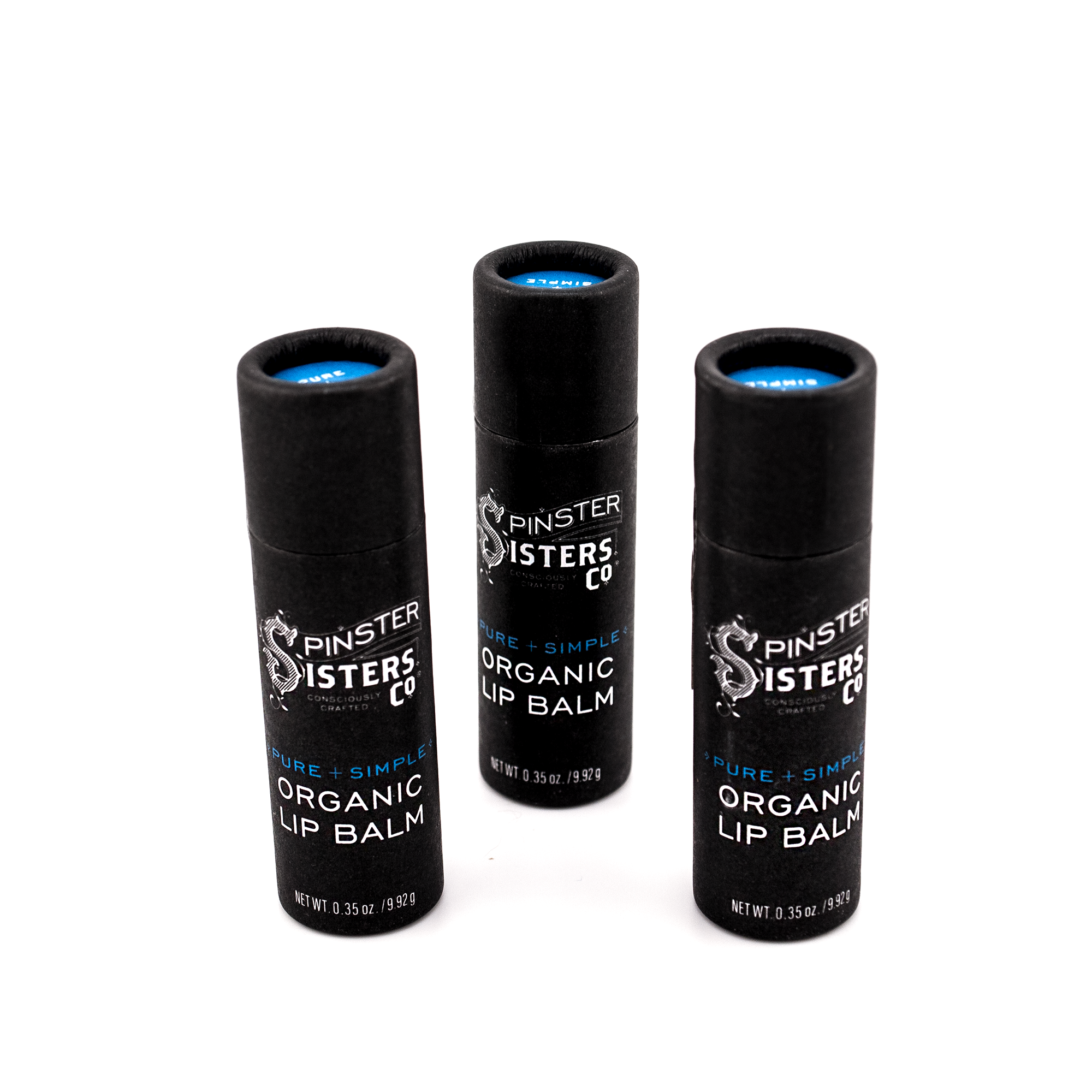 3 black paper tubes that say "Spinster Sisters Pure + Simple Organic Lip Balm" 