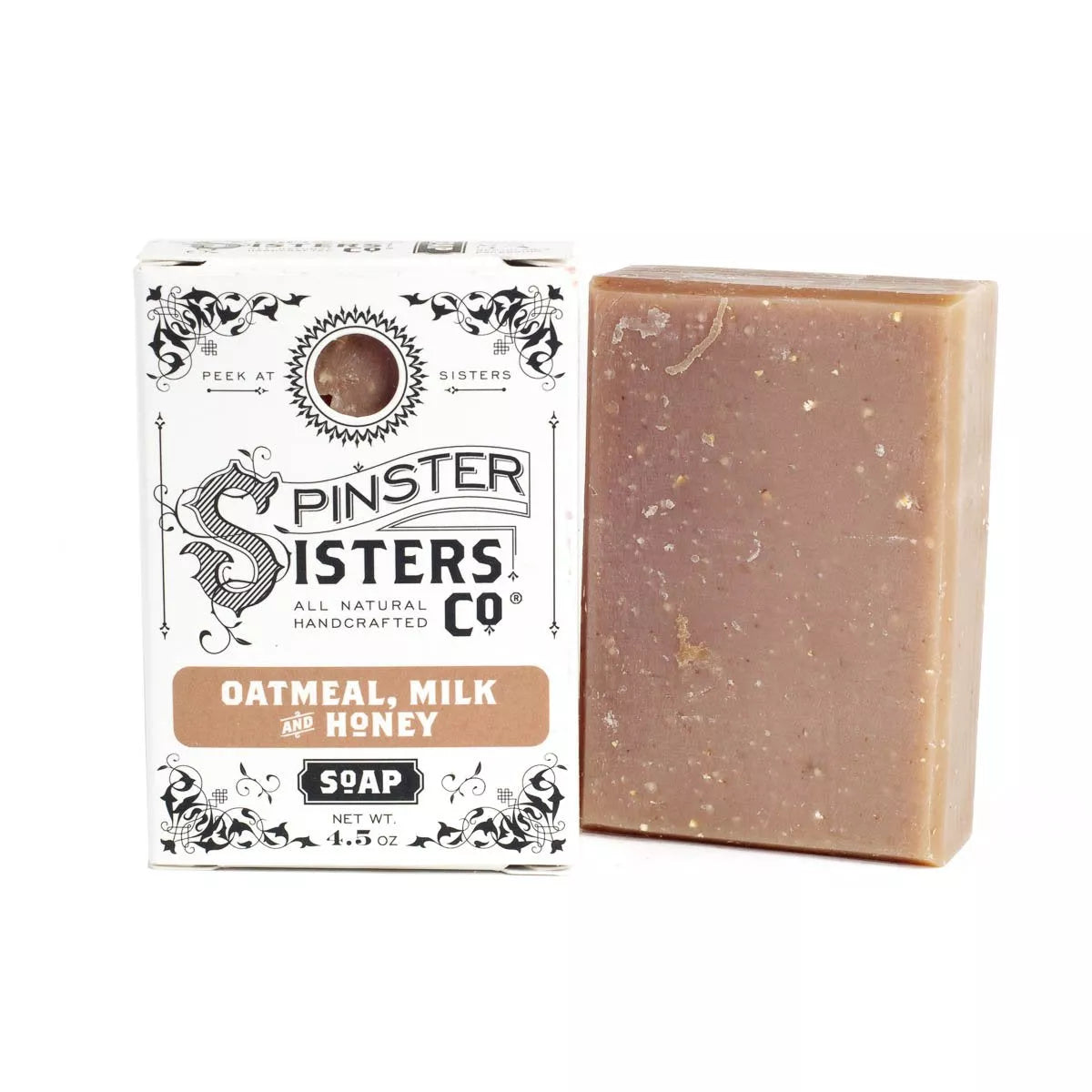 Box that reads Oatmeal, Milk and Honey  next to a  soap bar speckled with oatmeal